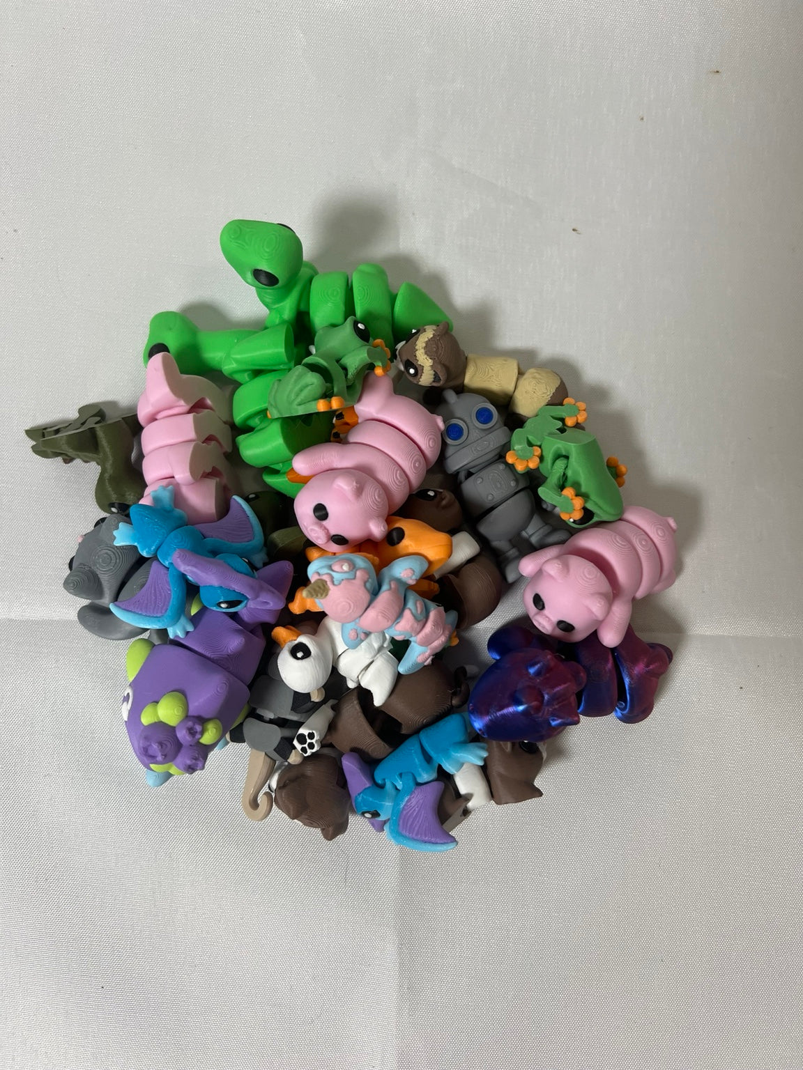 Assortment of colorful 3D printed mini animal and character collectibles