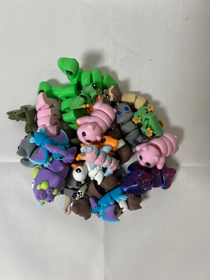 Assortment of colorful 3D printed mini animal and character collectibles