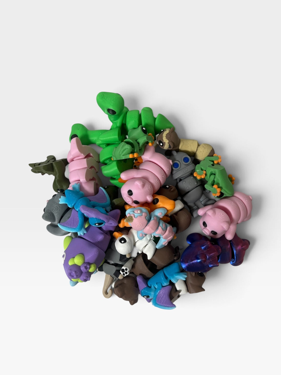 Assorted colorful 3D printed Pocket Pals mini collectibles
